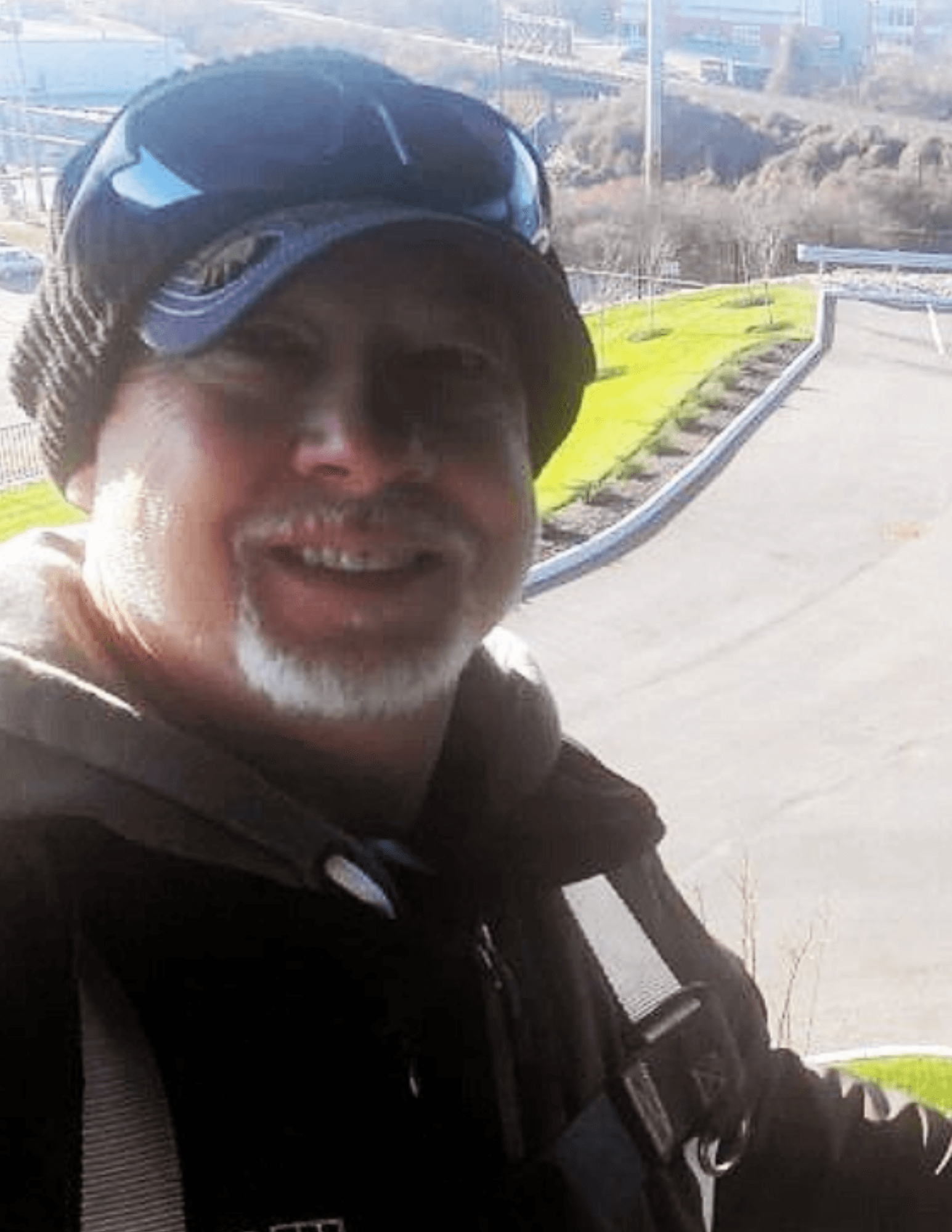 Tony-albert-owner-of-alberts-window-cleaning--above-a-parking-lot-cleaning-windows Learn More About Albert's Window Cleaning LLC