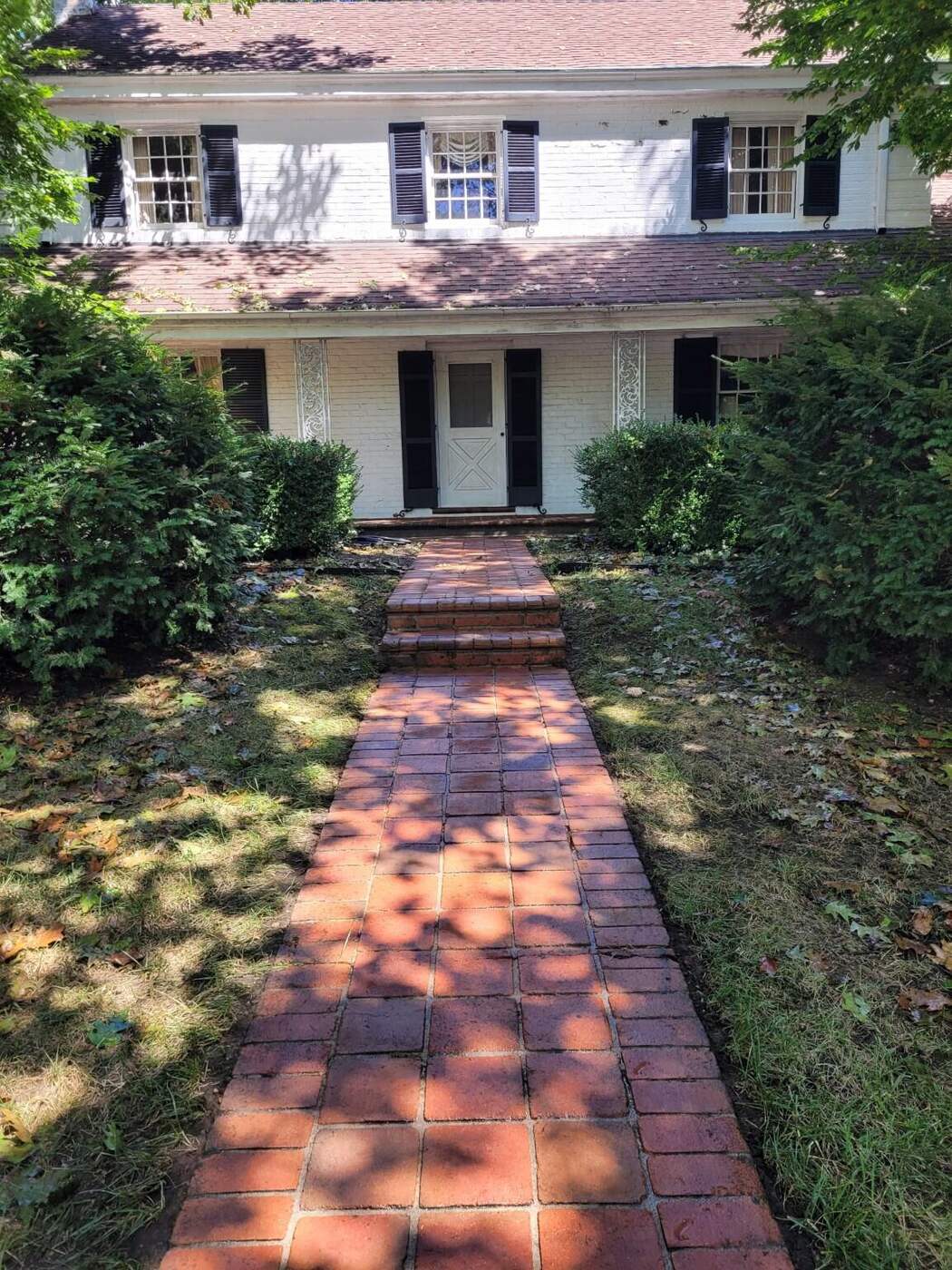 Real pressure washing and surface cleaning results Clean brick walkway after professional surface cleaning